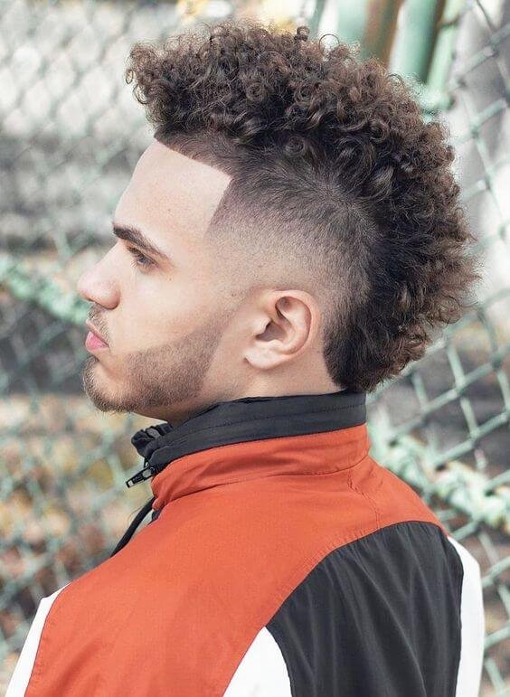 13. Curly Mohawk with Fade for Men