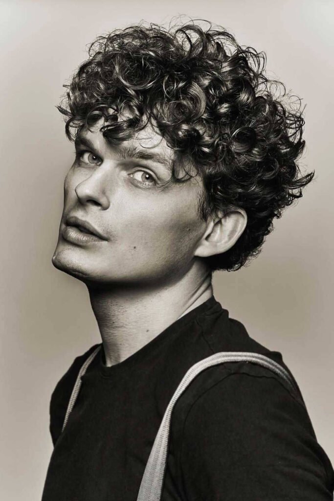 5. Textured Curly Fringe Hairstyle for Men