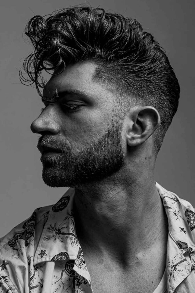 8. Mid Length Curly Pompadour Hairstyle for Men