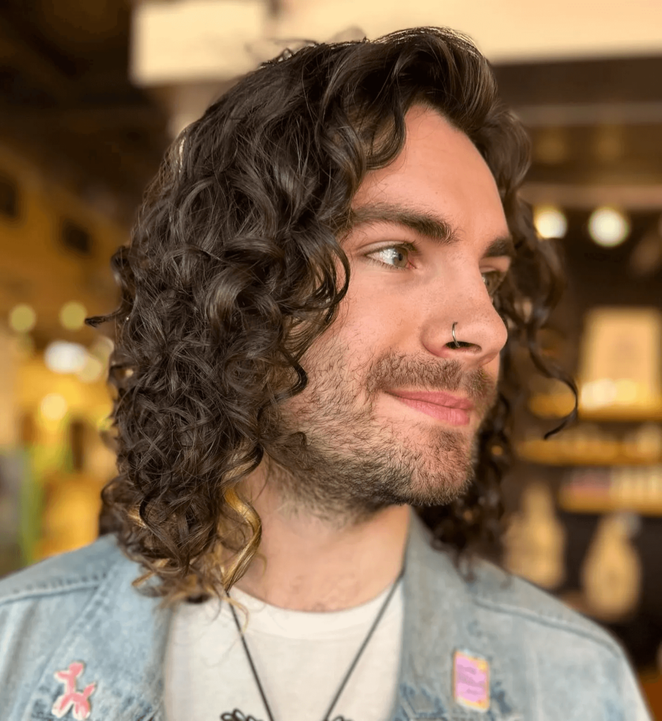 9. Shoulder Length Loose Curls Hairstyle Men